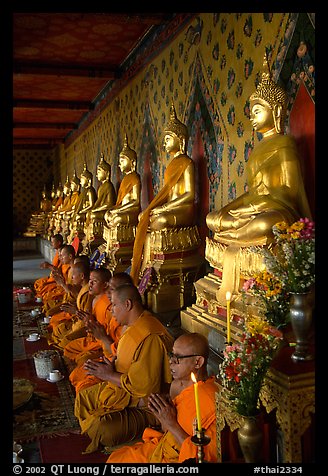 Buddhist monks and buddha statues, Wat Arun. Bangkok, Thailand