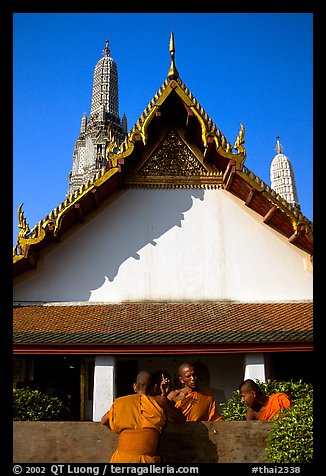 Monks outside Wat Arun. Bangkok, Thailand