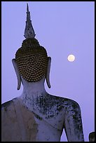 Moon and buddha image at dusk, Wat Mahathat. Sukothai, Thailand