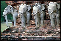 Some of the 36 elephants at the base of Wat Cahang Lom. Sukothai, Thailand ( color)