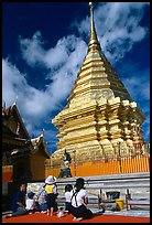 Worshipers at the Chedi of Wat Phra That Doi Suthep. Chiang Mai, Thailand (color)
