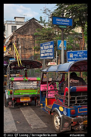 Tuk Tuks and signs. Bangkok, Thailand