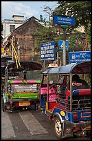 Tuk Tuks and signs. Bangkok, Thailand ( color)