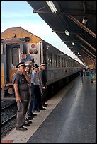 Attendants and train, Hualamphong station. Bangkok, Thailand (color)
