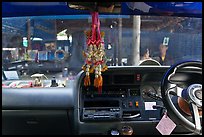 Bus dashboard with religious items. Thailand ( color)