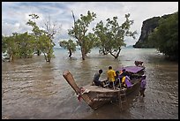 Boat boarding amongst mangroves, Ao Railay East. Krabi Province, Thailand (color)