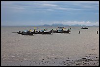 Boats anchored at low tide, storm sky,  Railay East. Krabi Province, Thailand (color)