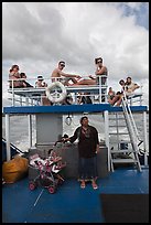 Local woman and tourists on boat, Andaman Sea. Krabi Province, Thailand ( color)