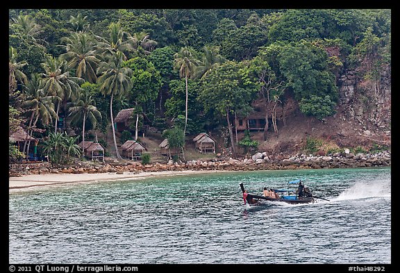 Long tail boat and beach cabins, Ko Phi Phi. Krabi Province, Thailand (color)