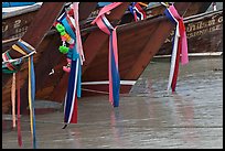 Prows of longtail boats with garlands, Ko Phi-Phi Don. Krabi Province, Thailand (color)