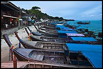 Boats and waterfront houses at dusk Ao Ton Sai, Ko Phi-Phi Don. Krabi Province, Thailand (color)
