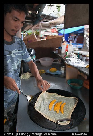 Man preparing thai pancake, Tonsai village, Ko Phi Phi. Krabi Province, Thailand