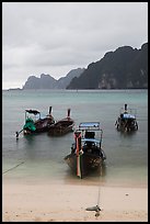 Beach and longtail boats in rainy weather, Ao Ton Sai, Ko Phi Phi. Krabi Province, Thailand (color)