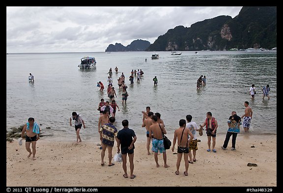 Beach with tourists arriving, Phi-Phi island. Krabi Province, Thailand (color)