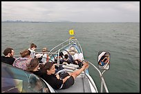 Passengers on prow of boat. Krabi Province, Thailand ( color)