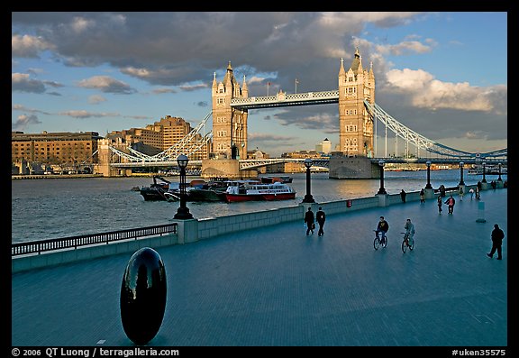 Waterfront promenade in the more London development and Tower Bridge, late afternoon. London, England, United Kingdom