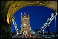 Arch and car traffic on the Tower Bridge at night. London, England, United Kingdom (color)