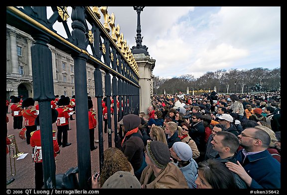 Crowds at the grids in front of Buckingham Palace watching the changing of the guard. London, England, United Kingdom