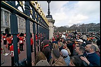 Crowds at the grids in front of Buckingham Palace watching the changing of the guard. London, England, United Kingdom ( color)