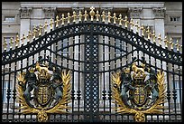 Entrance grids of Buckingham Palace with royalty emblems. London, England, United Kingdom ( color)