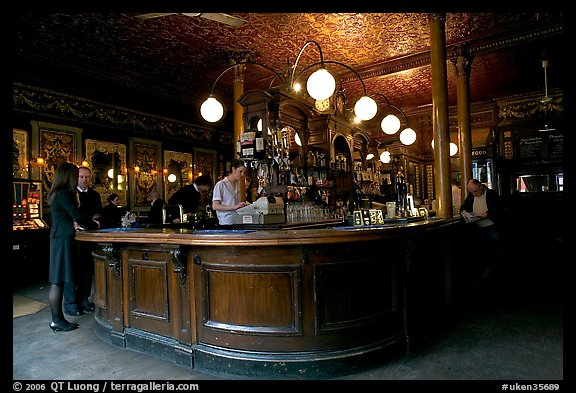 Central horseshoe bar in the 19th century victorian  pub Princess Louise. London, England, United Kingdom