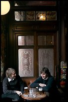 Young men, beer pints, and etched glass, pub Princess Louise. London, England, United Kingdom ( color)