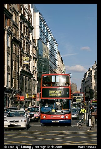 Double decker busses in a busy street. London, England, United Kingdom (color)