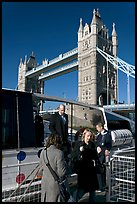 Passengers disembarking a boat in their morning commute, Tower Bridge in the background. London, England, United Kingdom ( color)