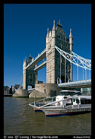 Catamaran below Tower Bridge. London, England, United Kingdom