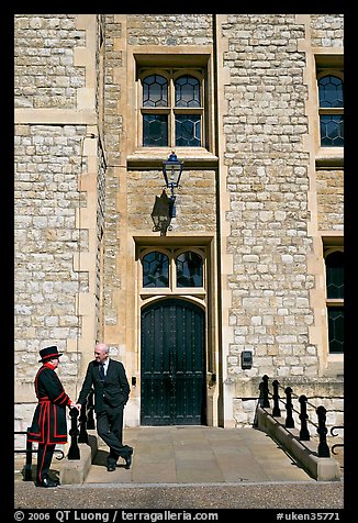 Yeoman Warder talking with man in suit in front of the Jewel House, Tower of London. London, England, United Kingdom (color)