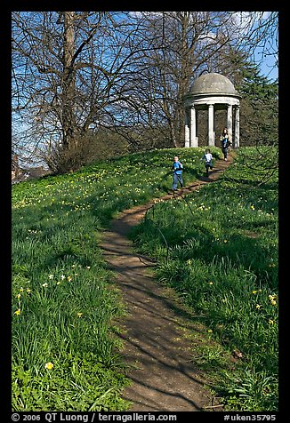 Children running down a trail leading to gazebo. Kew Royal Botanical Gardens,  London, England, United Kingdom