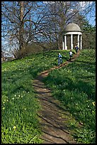 Children running down a trail leading to gazebo. Kew Royal Botanical Gardens,  London, England, United Kingdom (color)
