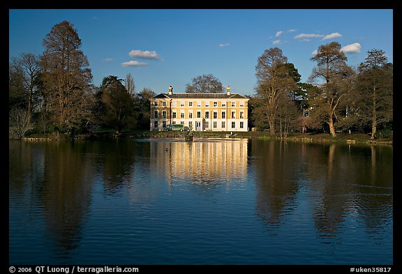 Museum No 1 reflected in lake, late afternoon. Kew Royal Botanical Gardens,  London, England, United Kingdom