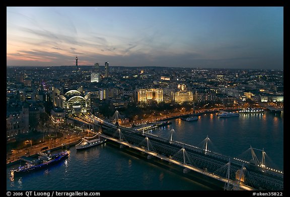 Aerial view of Charing Cross Station, Hungerford Bridge and Golden Jubilee Bridges at sunset. London, England, United Kingdom (color)