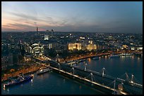 Aerial view of Charing Cross Station, Hungerford Bridge and Golden Jubilee Bridges at sunset. London, England, United Kingdom ( color)
