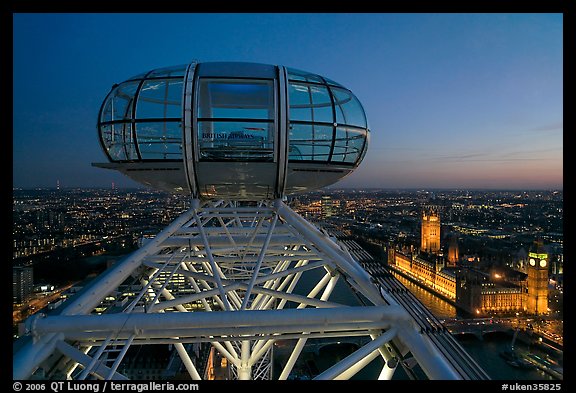 Millenium Wheel capsule and Houses of Parliament at dusk. London, England, United Kingdom