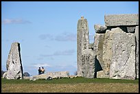 Couple looking at the standing stones, Stonehenge, Salisbury. England, United Kingdom ( color)