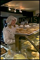 Woman wearing old-fashioned attire in a bakery, Lacock. Wiltshire, England, United Kingdom (color)