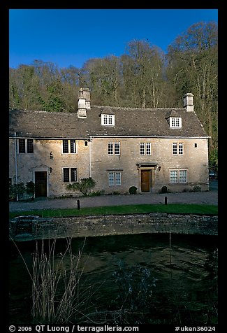 Cotswold type houses and Bybrook River, Castle Combe. Wiltshire, England, United Kingdom (color)
