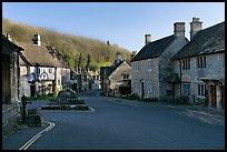 Main village street,  half timbered Court House, and Butter Cross, Castle Combe. Wiltshire, England, United Kingdom (color)