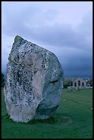 Standing stone and chapel at dusk, Avebury, Wiltshire. England, United Kingdom ( color)