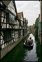 Half-timbered house, canal, and rowboat. Canterbury,  Kent, England, United Kingdom