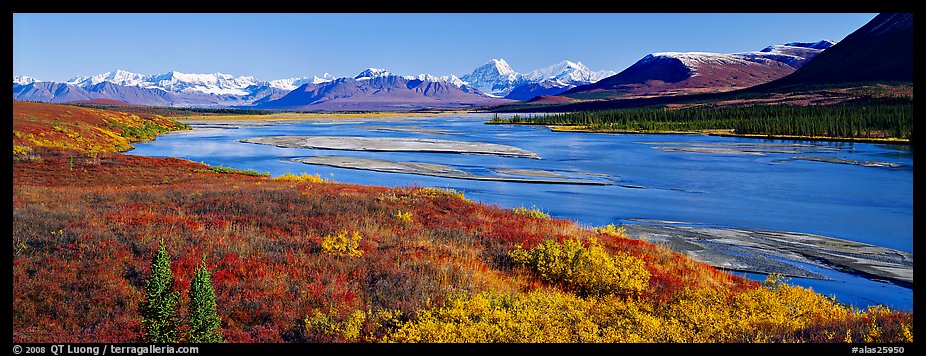 Tundra autumn scenery with wide river and mountains. Alaska, USA
