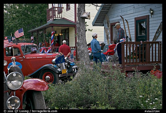 Vintage cars and houses on main street. McCarthy, Alaska, USA