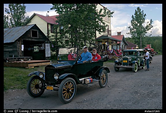 Classic cars driven on main street. McCarthy, Alaska, USA