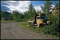 Side street with wrecked truck. McCarthy, Alaska, USA (color)