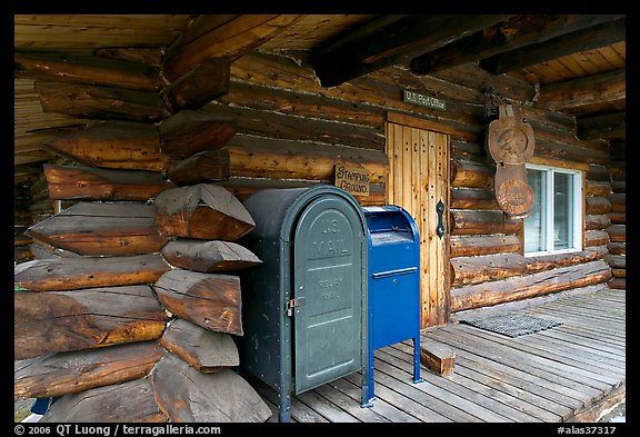 Mail boxes, log house postal office, Slana. Alaska, USA