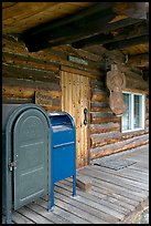 postal boxes, log house postal office, Slana. Alaska, USA (color)