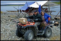 Inupiaq Eskimo man and woman riding on a four-wheeler, Ambler. North Western Alaska, USA (color)