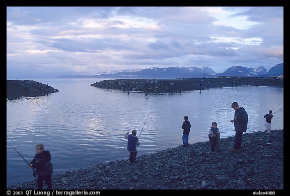 Fishing for salmon in the Spit's Fishing Hole. Homer, Alaska, USA